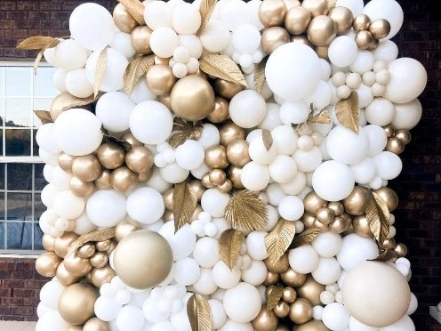 Full ivory, white and gold balloon wall with gilded leaf detailing
